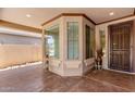 Covered entryway with a bay window and door at 38167 W Santa Clara Ave, Maricopa, AZ 85138