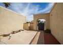 Private courtyard with stone benches and a gated entrance at 4760 W Wahalla Ln, Glendale, AZ 85308