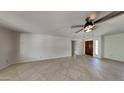 Bright living room with tile flooring and neutral color palette at 9623 W Wescott Dr, Peoria, AZ 85382
