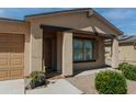 Inviting front entrance with a covered porch and attractive landscaping at 160 S Azteca Dr, Eloy, AZ 85131