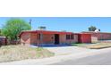 Charming brick ranch home with a covered porch and spacious yard at 437 W Hartford Rd, Kearny, AZ 85137