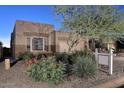 Single-story home with a two-car garage and mature landscaping at 9586 E Chuckwagon Ln, Scottsdale, AZ 85262