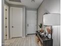Modern entryway with tile flooring and a stylish console table at 1859 N Westfall Ln, Casa Grande, AZ 85122