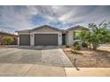 Two-story home with a two-car garage and paver driveway at 1859 N Westfall Ln, Casa Grande, AZ 85122