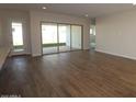 Bright and airy living room with sliding glass doors leading to the backyard at 9721 S Gold Stone Trl, Apache Junction, AZ 85120