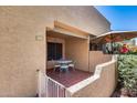Small patio with table and chairs, offering a relaxing outdoor space at 14300 W Bell Rd # 505, Surprise, AZ 85374
