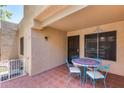 Cozy patio with a small table and chairs, perfect for relaxing at 14300 W Bell Rd # 505, Surprise, AZ 85374