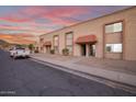 Sunset view of the building from the street at 10411 N 11Th Ave # 40, Phoenix, AZ 85021