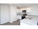 Modern kitchen with white cabinets and granite counters at 3820 N Zapotec Ave, Eloy, AZ 85131