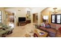 Open living space with a comfortable sectional sofa and views to other rooms at 10220 E Cochise Dr, Scottsdale, AZ 85258