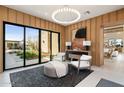 Sitting room with modern decor and sliding glass doors to patio at 24046 N 126Th Pl, Scottsdale, AZ 85255