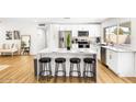 Modern kitchen with white cabinets, stainless steel appliances, and an island at 3233 S Lebanon Ln, Tempe, AZ 85282