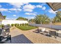 Backyard with putting green, patio, and grill at 3406 E Libby St, Phoenix, AZ 85032