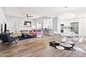 Open living room with hardwood floors, pink sofa, and modern decor at 8634 E Monterosa Ave, Scottsdale, AZ 85251