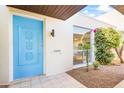 Bright entryway with blue door and desert landscaping at 8634 E Monterosa Ave, Scottsdale, AZ 85251