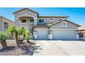 Beautiful two-story home with a three-car garage and inviting curb appeal at 17473 W Elizabeth Ave, Goodyear, AZ 85338