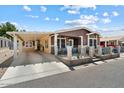 Well-maintained manufactured home with covered parking at 8865 E Baseline Rd # 128, Mesa, AZ 85209