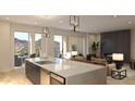 Open kitchen with island, mountain views and modern finishes at 18720 N 101St St # 2006, Scottsdale, AZ 85255