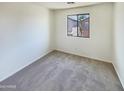 Simple bedroom with neutral wall color and carpet flooring at 4760 W Carson Rd, Laveen, AZ 85339