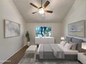 Cozy bedroom with a large window, ceiling fan, and staged bed at 7417 N Via Camello Del Norte -- # 160, Scottsdale, AZ 85258
