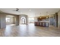 Open concept living and kitchen area with hardwood floors at 38718 N 24Th Ave, Phoenix, AZ 85086