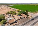 Aerial view of property and surrounding farmlands at 701 E Beloat Rd, Buckeye, AZ 85326