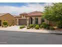 Single-story home with tile roof, attached garage, and well-manicured landscaping at 12164 S 184Th Ave, Goodyear, AZ 85338