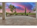Covered patio overlooking a stunning golf course sunset at 16401 W Monterey Way, Goodyear, AZ 85395