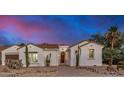 Spanish-style home with a welcoming entryway and landscaping at 16401 W Monterey Way, Goodyear, AZ 85395