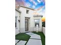 Elegant front entrance with a decorative door and landscaping at 613 E Harmony Way, Queen Creek, AZ 85140