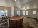 Kitchen with an island that overlooks a dining and living area at 650 N Hawes Rd # 3803, Mesa, AZ 85207