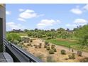 View of a beautiful golf course from a balcony at 15802 N 71St St # 307, Scottsdale, AZ 85254