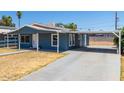 Newly painted blue house with carport at 113 S 92Nd Ave, Tolleson, AZ 85353