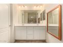 Double vanity bathroom with modern white cabinets at 19778 W Monroe St, Buckeye, AZ 85326