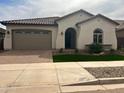 One-story home with a two-car garage at 15963 W Montana De Oro Dr, Surprise, AZ 85387