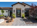 Stunning stone and wood exterior with a welcoming front entry at 6044 E Calle Del Paisano --, Scottsdale, AZ 85251