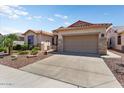 One-story home with desert landscaping and two-car garage at 17919 W Spencer Dr, Surprise, AZ 85374