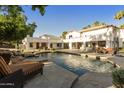 Luxury home with a large pool and patio area at 9030 N 48Th Pl, Paradise Valley, AZ 85253