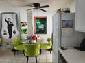 Dining area with green chairs and a glass table at 815 N Hayden Rd # B4, Scottsdale, AZ 85257