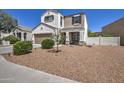 Two-story house with a brown garage door and nicely landscaped front yard at 3882 W Alabama Ln, San Tan Valley, AZ 85144