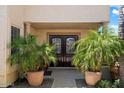 Inviting entryway with double doors and lush landscaping at 3406 E Wildwood Dr, Phoenix, AZ 85048