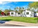 Newly renovated white single-story house with a yard at 4307 N 15Th Dr, Phoenix, AZ 85015