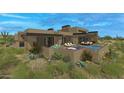 Modern desert home with a private pool and landscaped backyard at 10308 E Filaree Ln, Scottsdale, AZ 85262