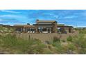 Modern home with a spacious backyard patio and beautiful mountain views at 10308 E Filaree Ln, Scottsdale, AZ 85262