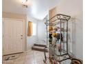 Bright entryway with tiled floors and staircase at 36989 W Bello Ln, Maricopa, AZ 85138