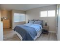 Bedroom with dresser, bed, and nightstand at 1111 E University Dr # 244, Tempe, AZ 85288