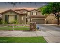 Two-story house with a three-car garage and landscaping at 3843 E Old Stone N Cir, Chandler, AZ 85249