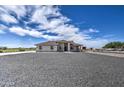 Single-story home with gravel driveway and rock landscaping at 1275 E Stetson Ln, Coolidge, AZ 85128