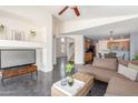Open living room with a view of kitchen and stairs leading upstairs at 35066 N Happy Jack Dr, San Tan Valley, AZ 85144