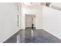 Bright and airy entryway with high ceilings and polished concrete floors at 35066 N Happy Jack Dr, San Tan Valley, AZ 85144